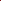 A close-up of multiple skeins of yarn in a rich, deep red color, arranged diagonally on a clean white background.