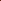 A close-up of tightly wound yarn skeins in a warm rust or burnt orange-brown color, photographed against a plain white background.