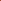A close-up of twisted skeins of yarn in a warm rust or terracotta color on a plain white background.
