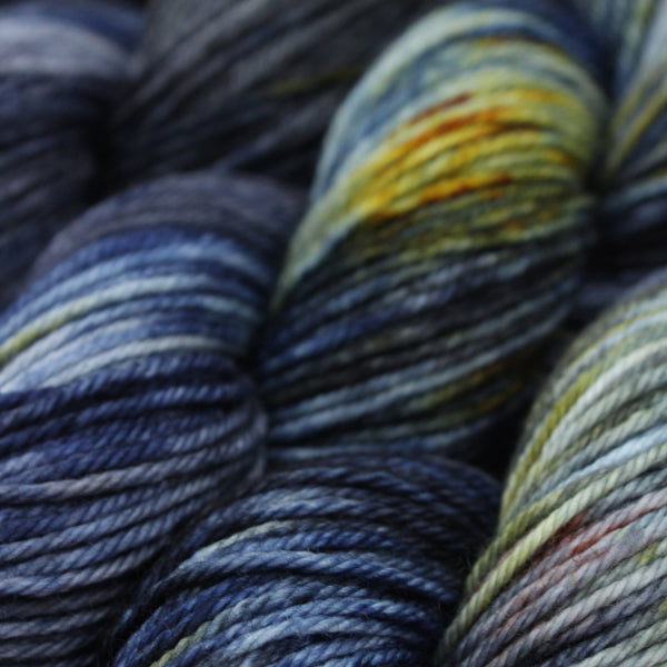 Hand dyed merino yarn, blues, yellow and red