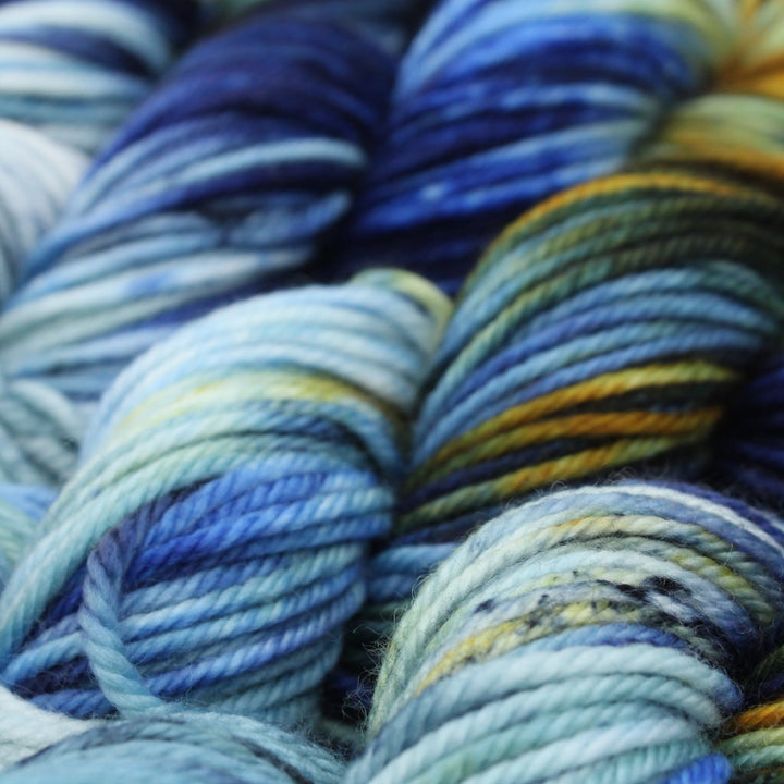 Handdyed merino 12 ply blue gold