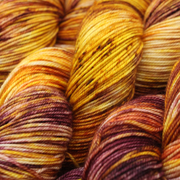 Handdyed merino 4ply yarn yallow brown purple